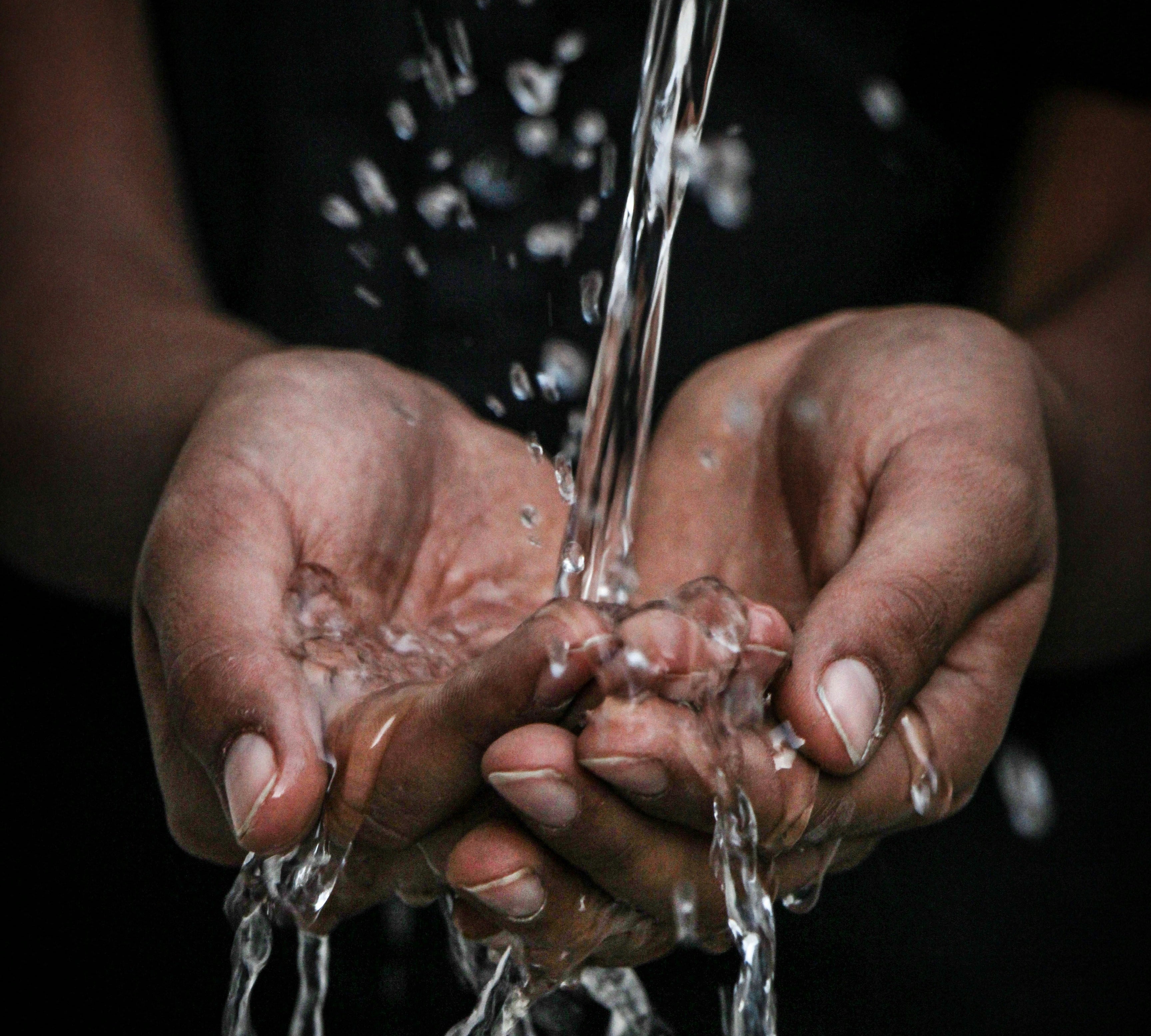 water splashing onto open palms