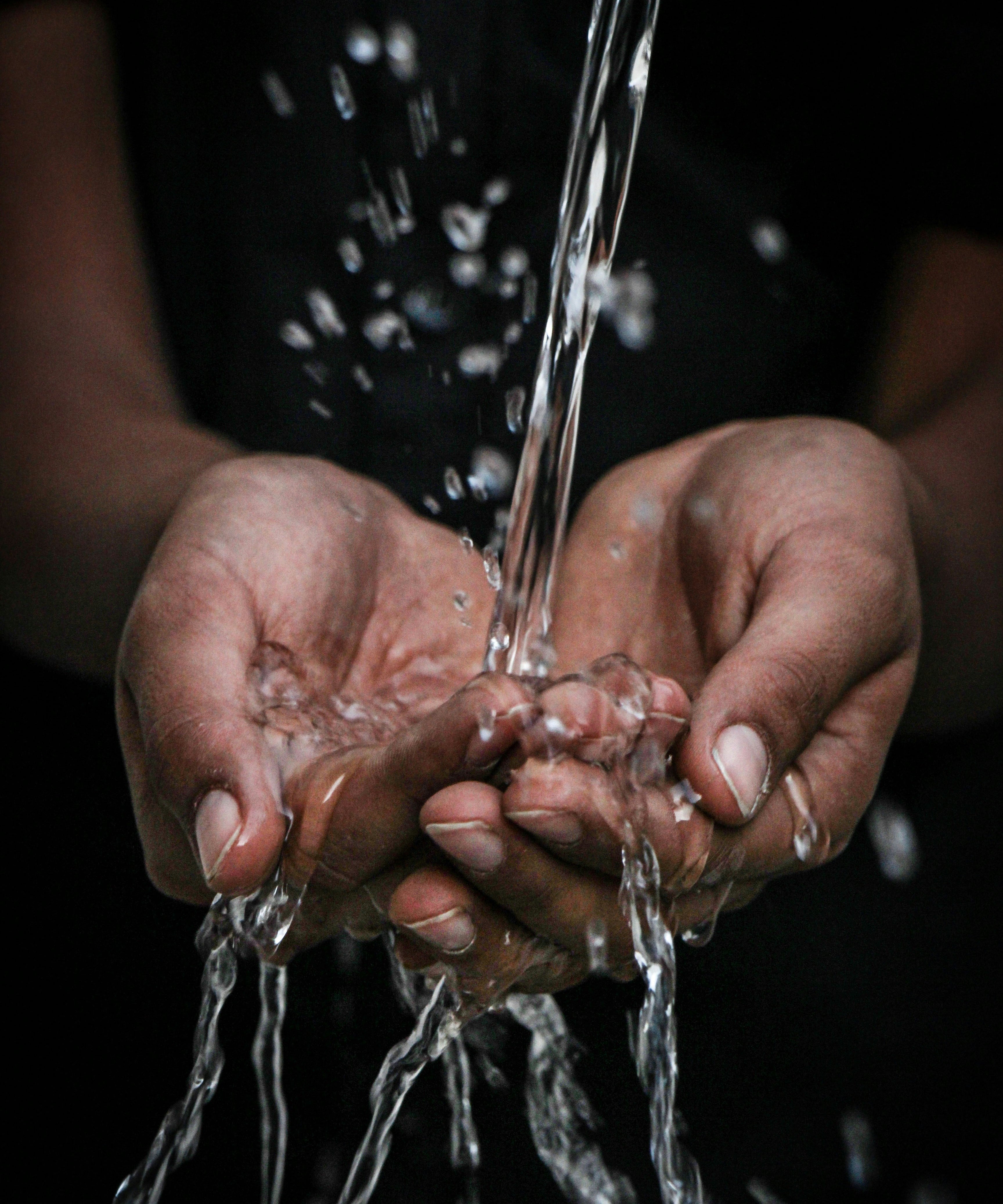 water splashing onto open palms