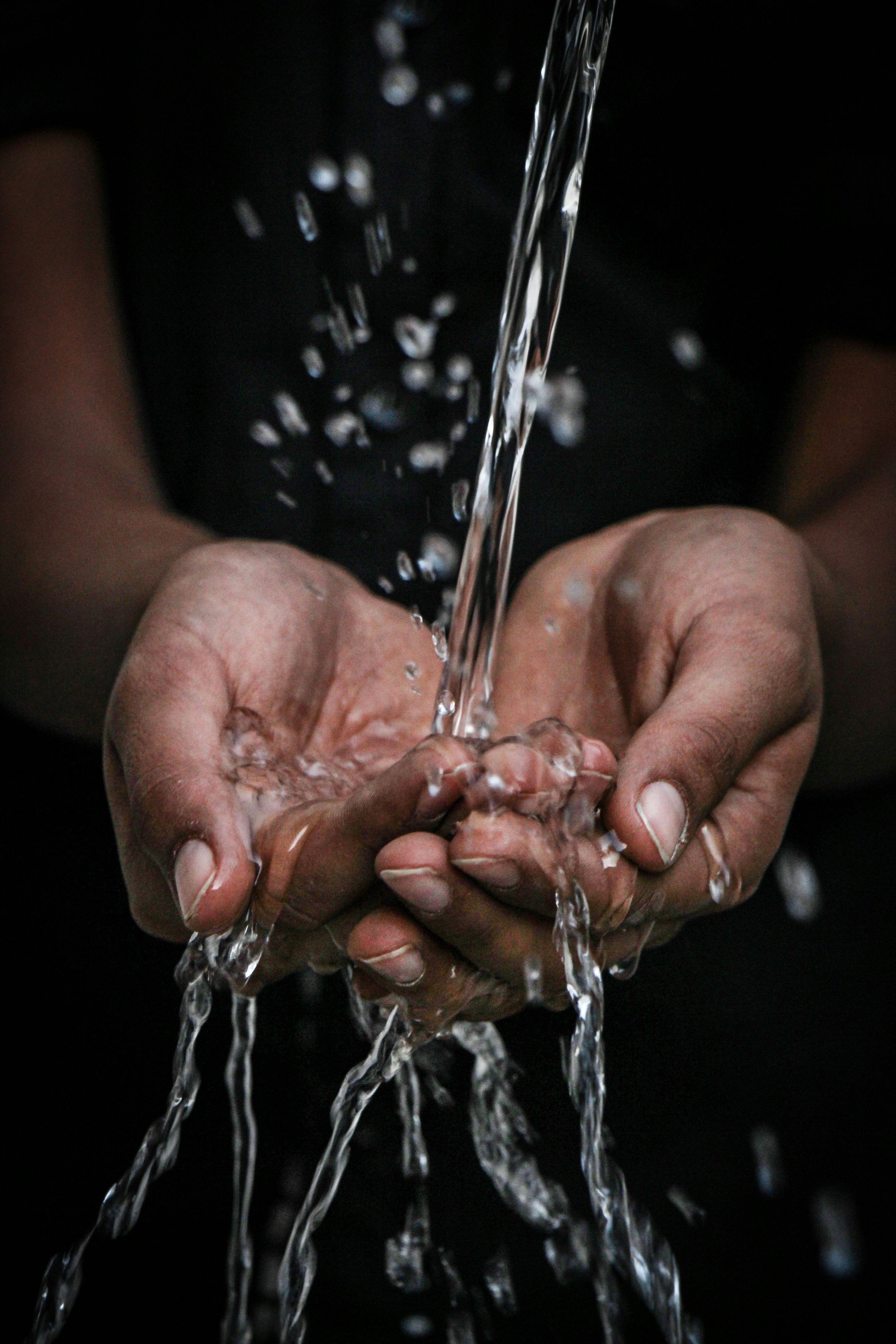 water splashing onto open palms